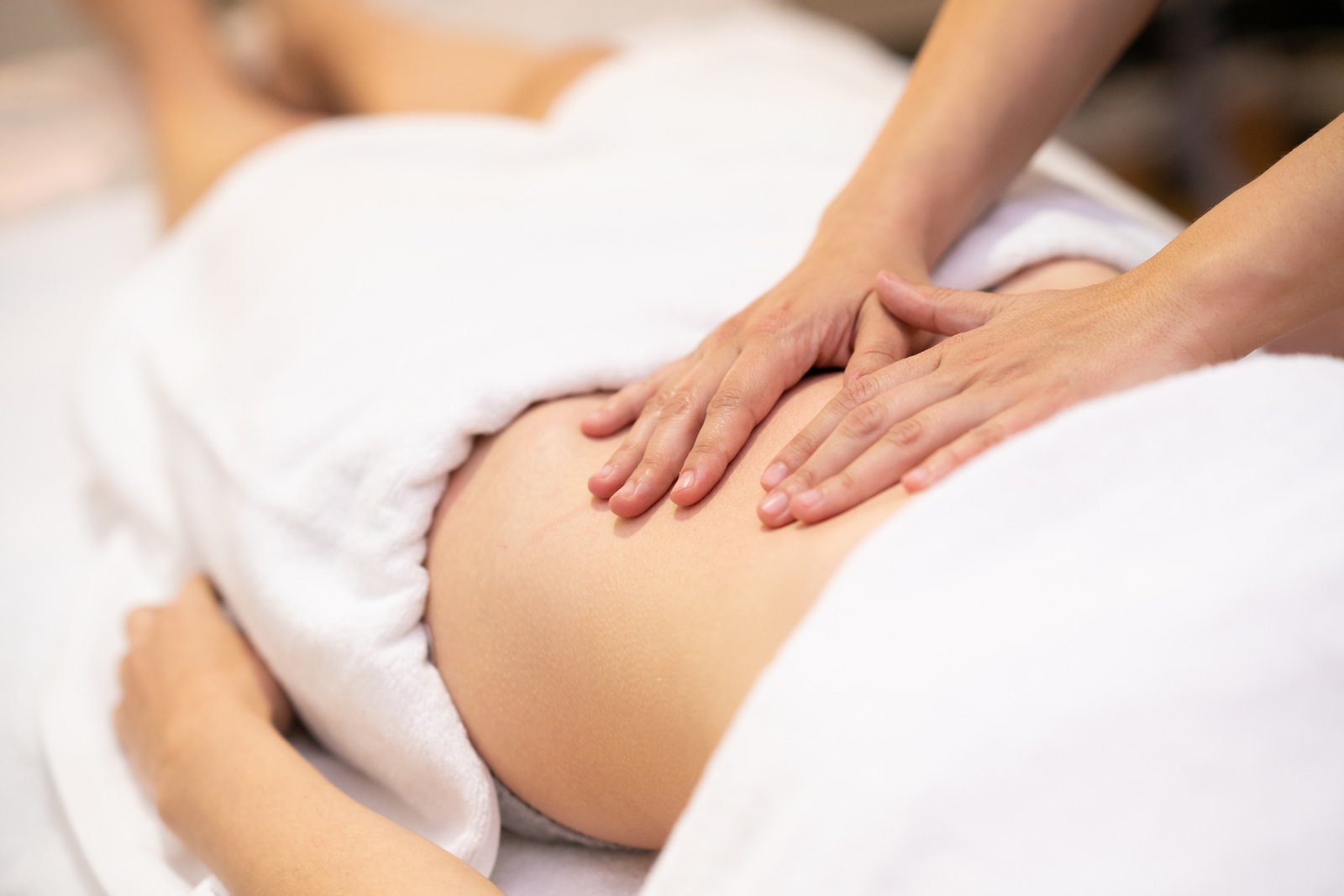 Woman Receiving a Belly Massage 