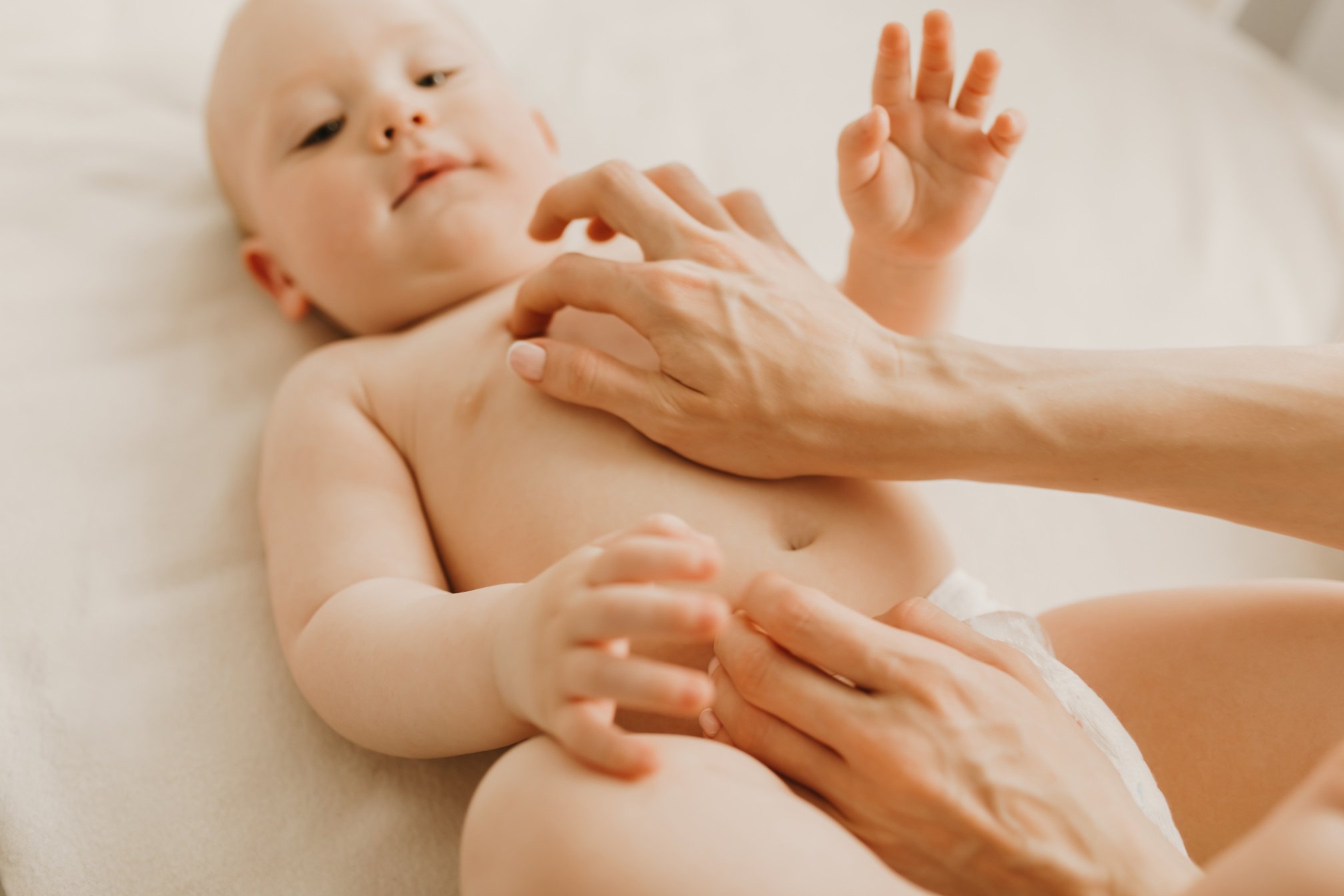 Baby Massage, Mom Massages the Baby's Belly during Colic